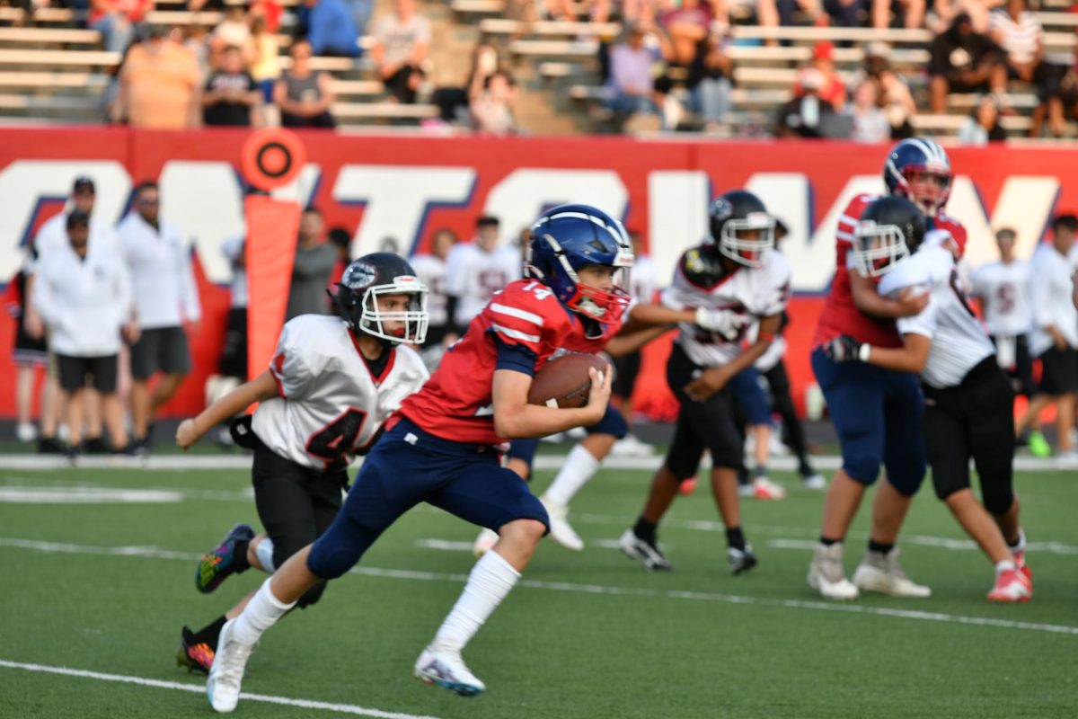 Quarter back, number 14, Vincent Dennis heading for a touchdown!