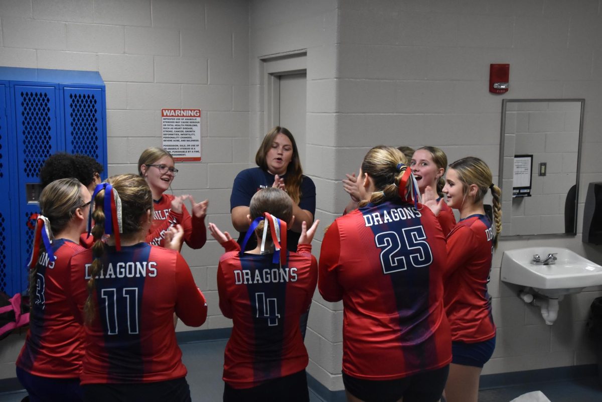 Eighth grade volleyball girls getting ready to beat Poland!