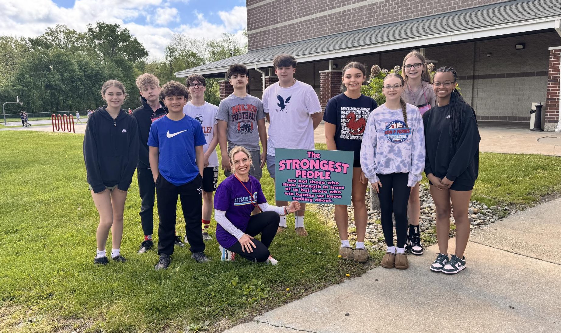 A group of eighth grade students with Mrs. Falleti.