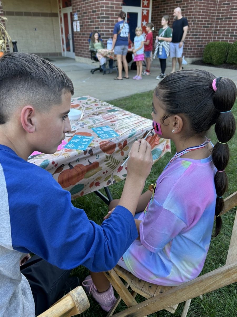 Parker having fun painting little kids faces!